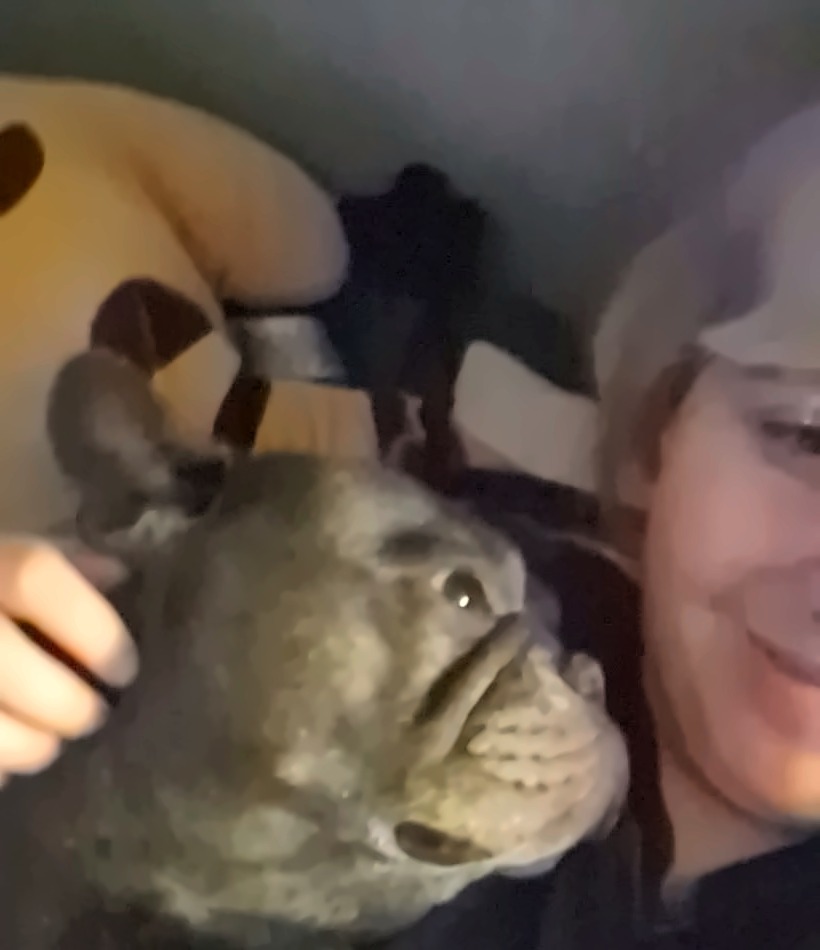 Jinx snuggling with her dog Fatboy